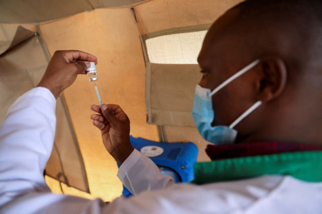 A healthcare professional prepares a dose of AstraZeneca (COVID-19) vaccine at the Narok County Referral Hospital, in Narok, Kenya, December 1, 2021. 