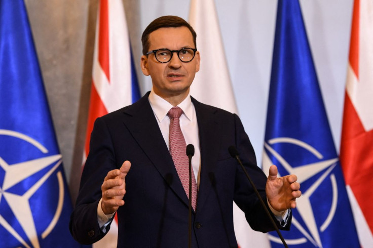 Polish Prime Minister Mateusz Morawiecki gestures as he speaks during a joint news conference with Britain's Prime Minister Boris Johnson (unseen) in Warsaw, Poland February 10, 2022 following a meeting. Daniel Leal/Pool via 