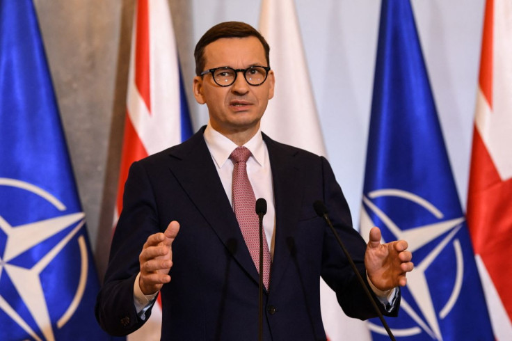 Polish Prime Minister Mateusz Morawiecki gestures as he speaks during a joint news conference with Britain's Prime Minister Boris Johnson (unseen) in Warsaw, Poland February 10, 2022 following a meeting. Daniel Leal/Pool via