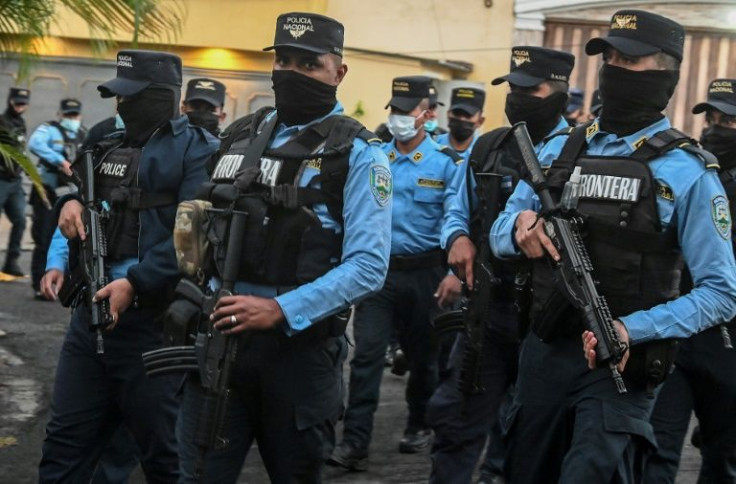 Honduran special forces agents surrounded ex-president Juan Orlando Hernandez's home in Tegucigalpa after the US requested his extradition