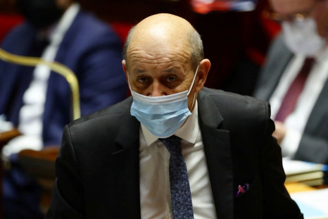 French Foreign Minister Jean-Yves Le Drian, wearing a protective face mask, attends the questions to the government session at the National Assembly in Paris, France, February 1, 2022. 