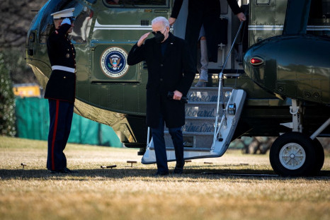 U.S. President Joe Biden salutes a Marine as he arrives on Marine One on the South Lawn of the White House following a trip to Delaware, in Washington, D.C., U.S., February 6, 2022. 