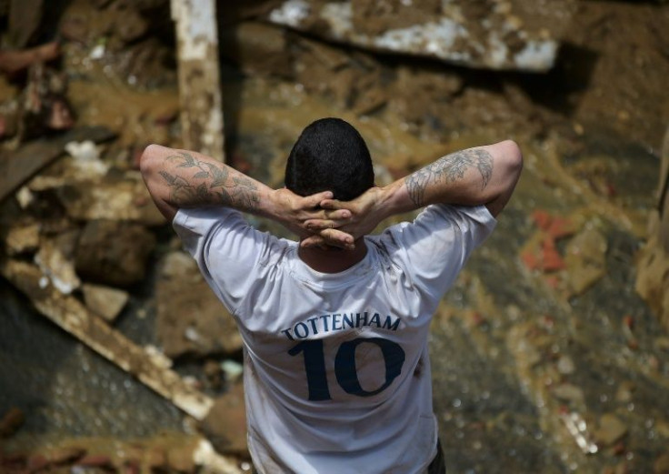 A man looks out over the flood zone in Petropolis, Brazil, February 16, 2022