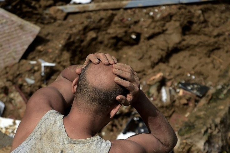 A man reacts after a mudslide in Petropolis, Brazil on February 16, 2022
