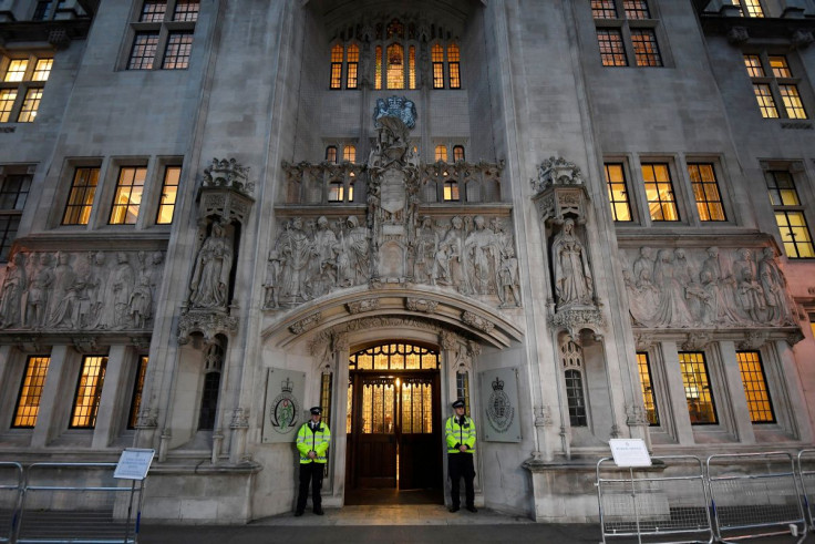 Police officers stand on duty outside the Supreme Court in Parliament Square, central London, Britain December 6, 2016.