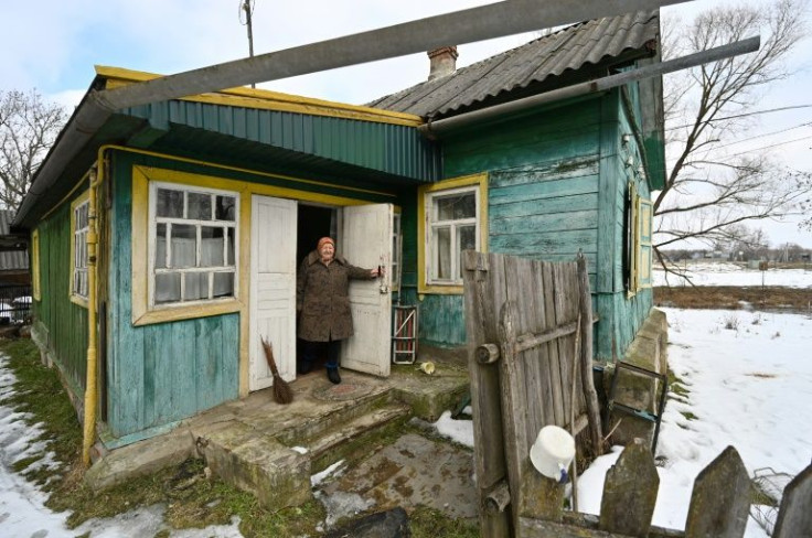Ukrainian pensioner Lidiya Silina's back yard runs up to the Belarus border, where Russian war games have set off fears on an invasion