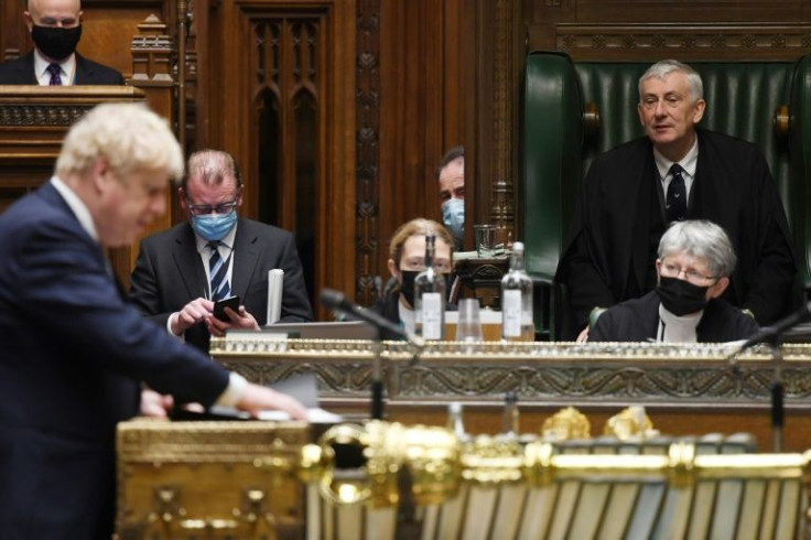 The speaker of Britain's House of Commons, Lindsay Hoyle, oversees proceedings as Prime Minister Boris Johnson updates MPs on the crisis in Ukraine