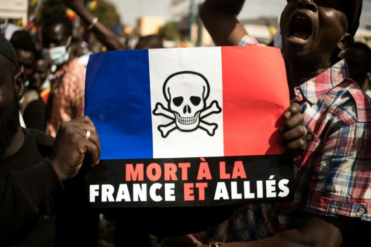 Demonstrators at a rally in Bamako last month sparked by sanctions against Mali by the West African bloc ECOWAS. The sign reads 'Death to France and its allies'