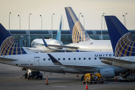 United Airlines planes are parked at their gates at O'Hare International Airport ahead of the Thanksgiving holiday in Chicago, Illinois, U.S., November 20, 2021.  