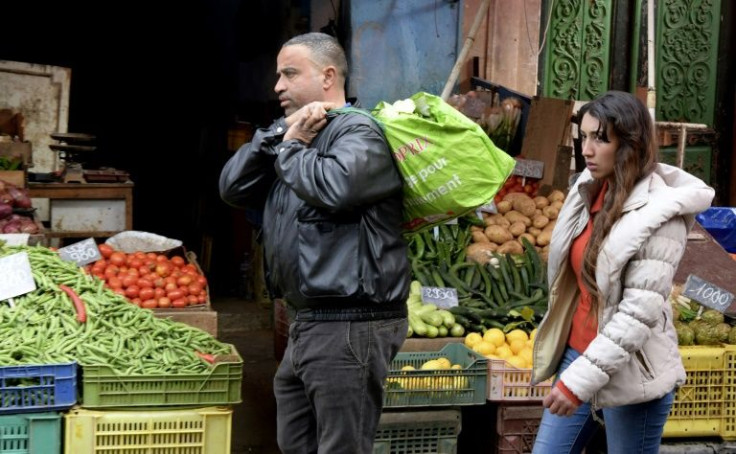 Tunisians shop at Halfaouine market near central Tunis on February 15, 2022. The Tunisian economy is plagued by recession, inflation and high unemployment