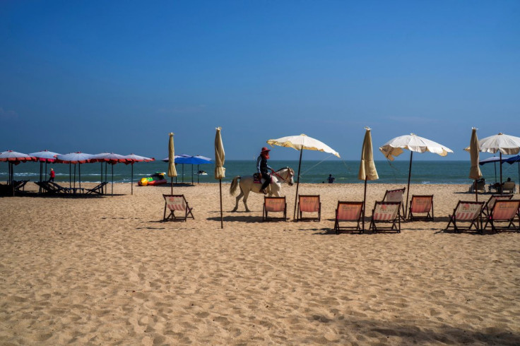 A man rides a horse at Cha-Am Beach, amid the coranavirus disease (COVID-19) outbreak, in Phetchaburi province, Thailand, December 25, 2021.