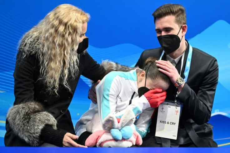 Russia's Kamila Valieva is distraught after her free-skate routine, with coach Eteri Tutberidze to her right