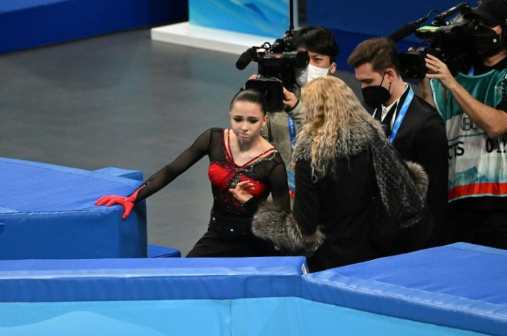 Russian coach Eteri Tutberidz talks to Kamila Valieva after the women's single free skating event during the Beijing 2022 Winter Olympic Games