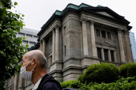 A man wearing a protective mask stands in front of the headquarters of Bank of Japan amid the coronavirus disease (COVID-19) outbreak in Tokyo, Japan, May 22, 2020.
