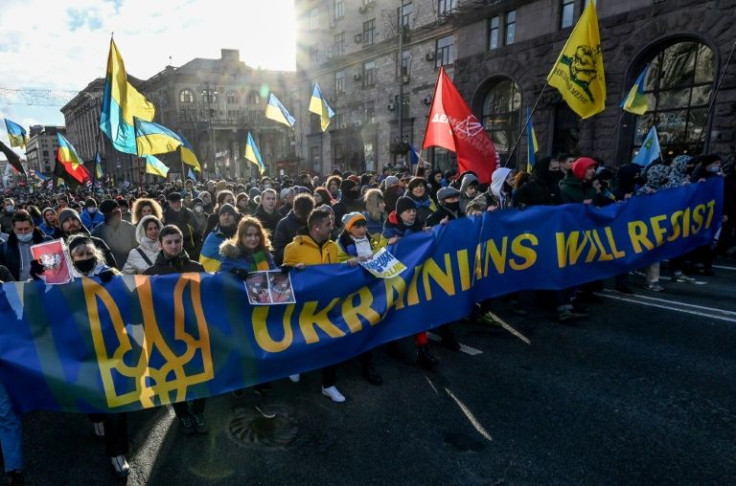 Ukrainians have responded to Russia's war games by defiantly marching through the streets of Kyiv