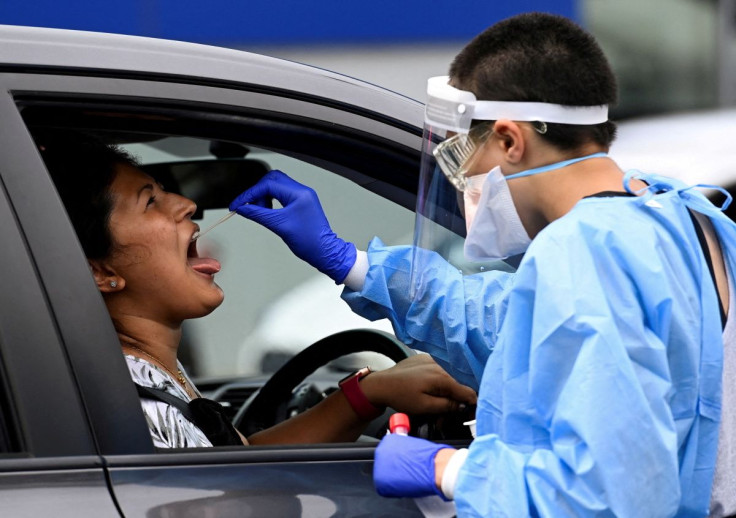 A woman takes a test for the coronavirus disease (COVID-19) at a testing centre in Sydney, Australia, January 5, 2022.