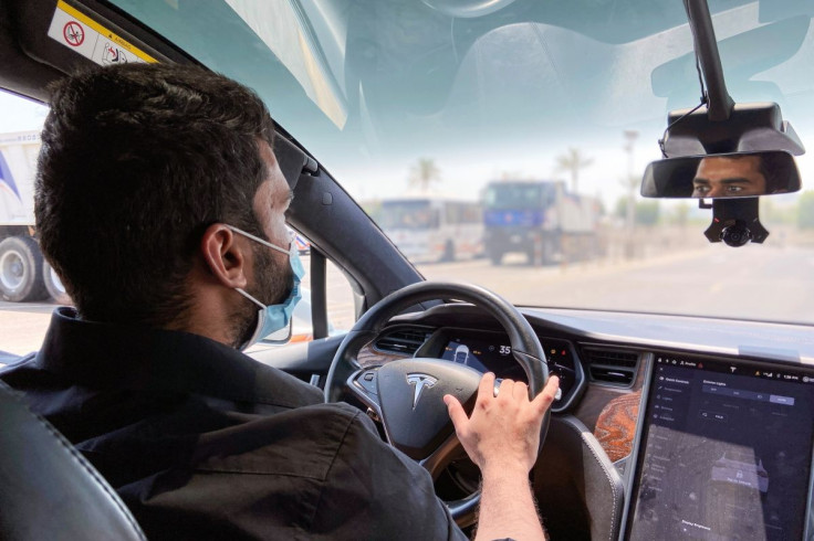 FILE PHOTO - A student learns how to drive in a Tesla learns at the Emirates Driving Institute which offers students to learn how to drive on luxury cars, in Dubai, United Arab Emirates, June 14, 2021.