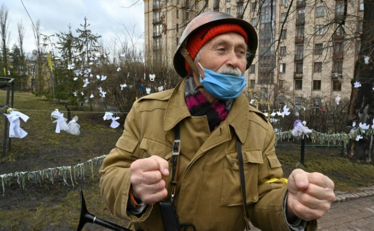 As shelling continued in the east of the country, in Kyiv veterans of the revolt against a previous pro-Russian leader remembered their victory