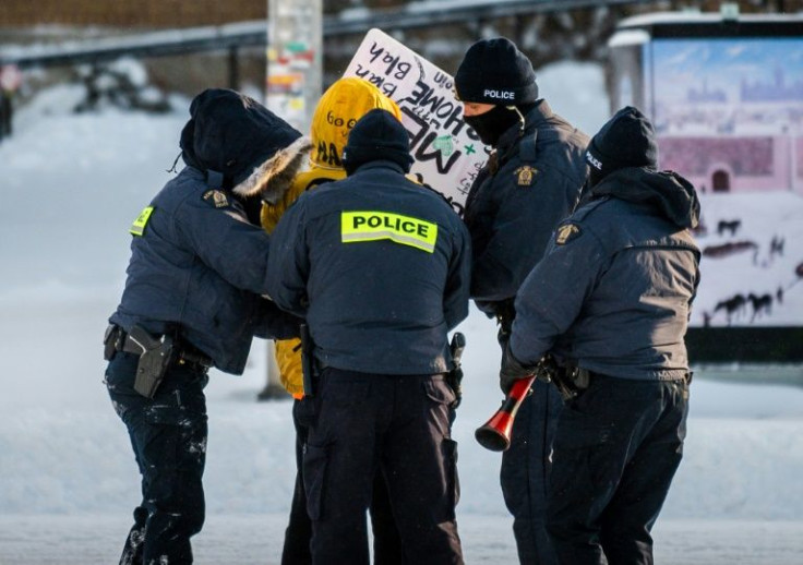 A demonstrator is arrested by police in Ottawa on February 18, 2022, as they begin to remove protesters demanding an end to Covid-19 mandates