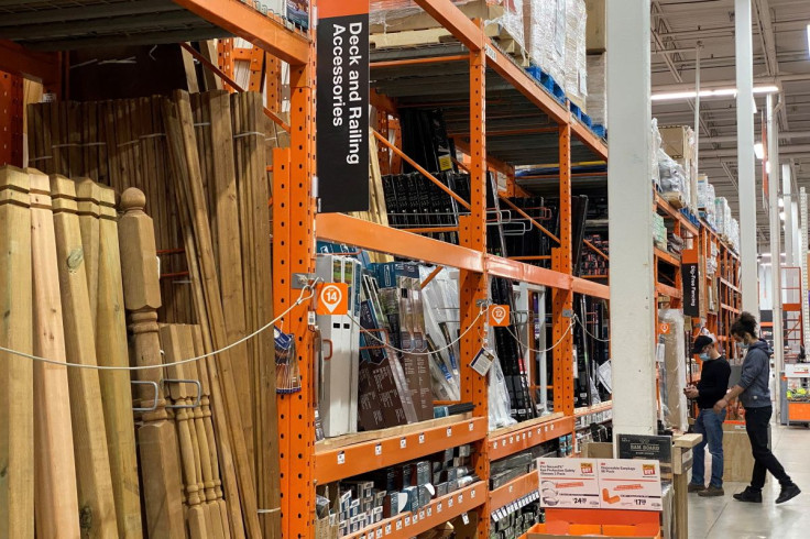 Customers browse among the decking supplies aisle in a Home Depot store in Toronto, Ontario, Canada March 21, 2021.