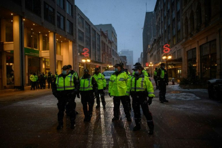 Police officers were seen massing ahead of a huge police operation clear a trucker-led protest over pandemic health rules, outside Canada's parliament
