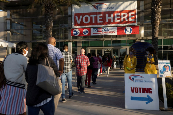 Poll workers wait in line to grab breakfast prior to the polls opening at the Registrar of Voters on the day of the U.S. Presidential election in San Diego, California, U.S., November 3, 2020.