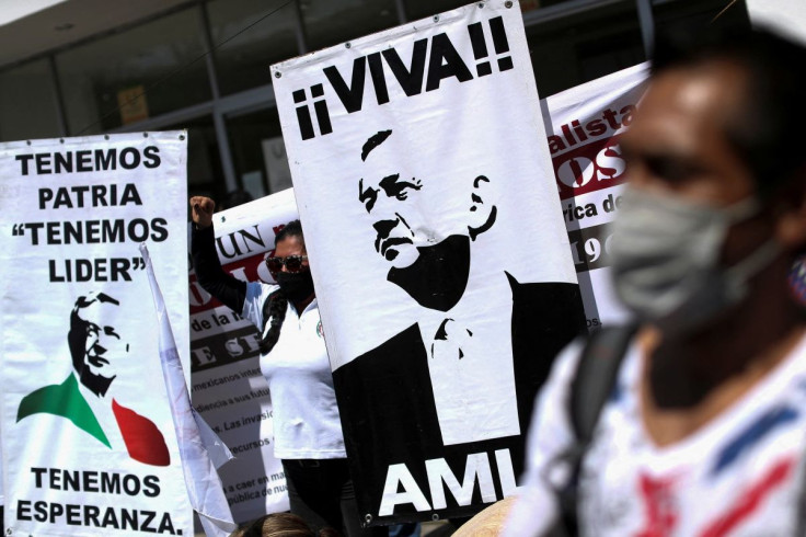 A demonstrator gestures in support of Mexico's President Andres Manuel Lopez Obrador and his plan to boost state control of the power market during a demonstration outside National Congress in Mexico City, Mexico, February 17, 2022.
