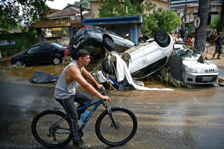Destroyed cars have been left strewn across Petropolis, but locals say motorcycles are the key to getting aid to hillside communities