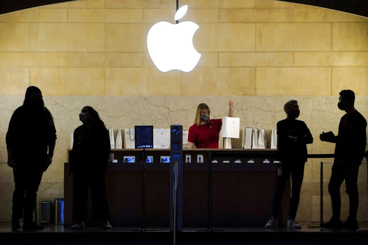 Apple employees work in an Apple Store at the Grand Central Terminal in the Manhattan borough of New York City, New York, U.S., January 4, 2022.