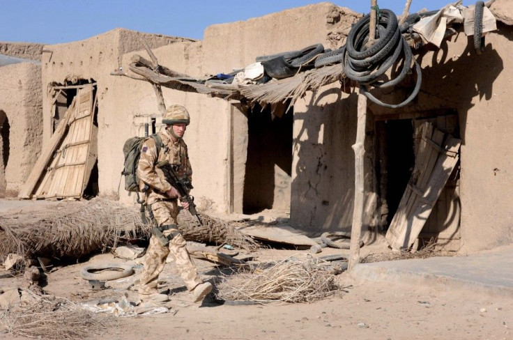 Britain&#039;s Prince Harry patrols through the deserted town of Garmisir, Southern Helmand Province, Afghanistan