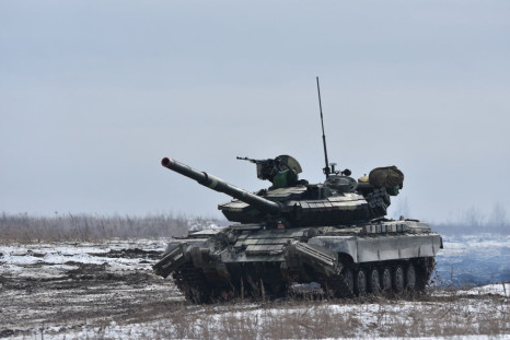 Ukrainian servicemen drive a tank during drills at a training ground in unknown location in Ukraine, in this handout picture released February 18, 2022. Ukrainian Joint Forces Operation Press Service/Handout via REUTERS 