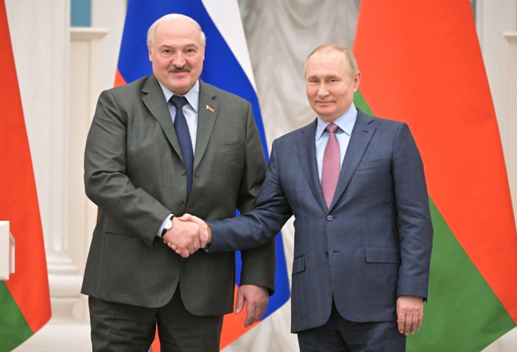 Russian President Vladimir Putin and Belarusian President Alexander Lukashenko shake hands during a joint news conference in Moscow, Russia February 18, 2022. Sputnik/Sergey Guneev/Kremlin via REUTERS