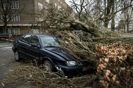 Storm Eunice has killed at least 13 people in Europe and caused damage including to this car in Amsterdam