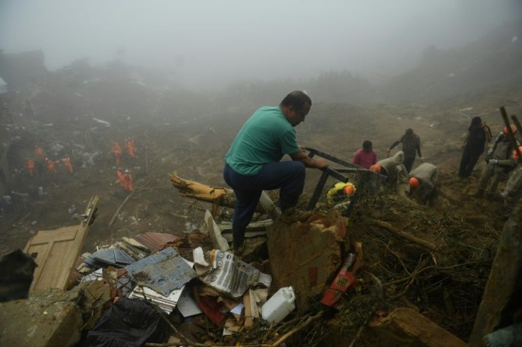 People search for victims after flooding and landslides in Petropolis, Brazil on February 19, 2022