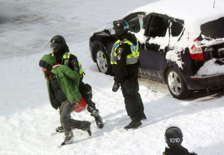 Police arrest a demonstrator on February 19, 2022 in Ottawa, Canada