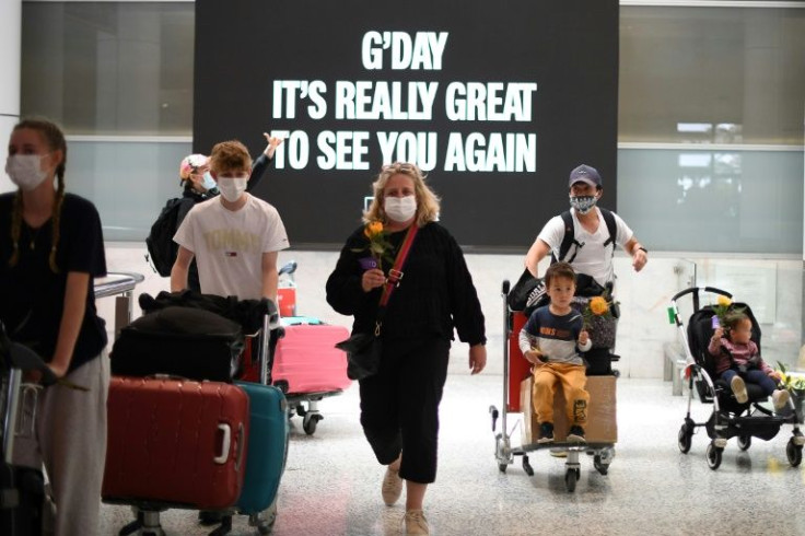 Travellers arrive at Sydney Airport last year