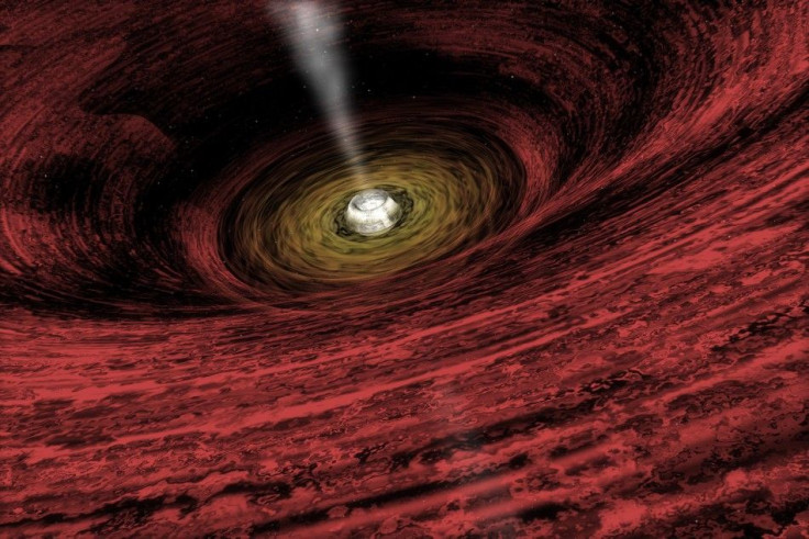 An artist's impression of a growing supermassive black hole located in the early Universe is seen in this NASA handout illustration released on June 15, 2011.