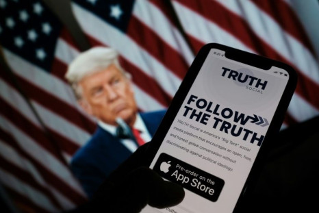 Donald Trump's new 'Truth Social' app is seen on a smartphone screen before a picture of the former president