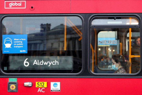 A coronavirus disease (COVID-19) notice is seen in the window of a bus in London, Britain February 20, 2022. 