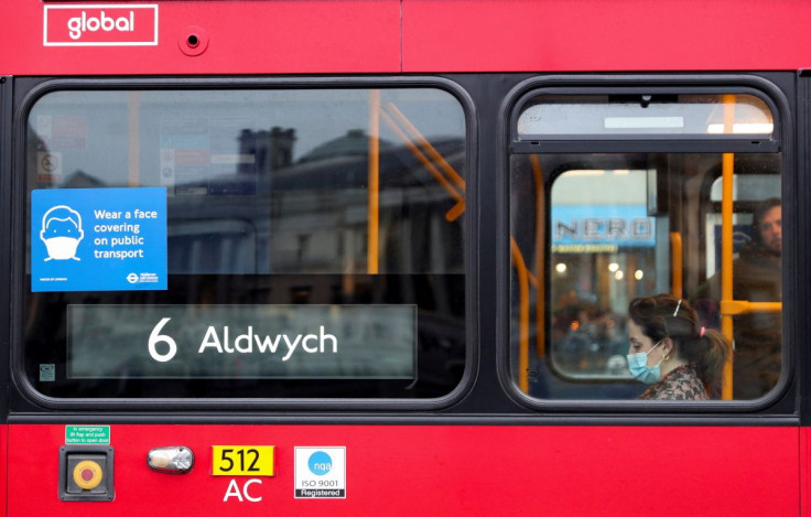 A coronavirus disease (COVID-19) notice is seen in the window of a bus in London, Britain February 20, 2022. 