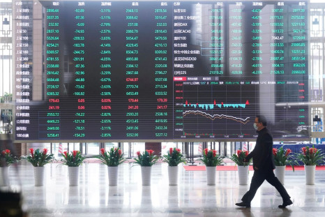 A man wearing a face mask is seen inside the Shanghai Stock Exchange building, as the country is hit by a novel coronavirus outbreak, at the Pudong financial district in Shanghai, China February 28, 2020.  