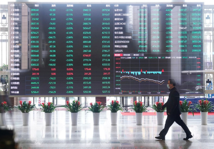 A man wearing a face mask is seen inside the Shanghai Stock Exchange building, as the country is hit by a novel coronavirus outbreak, at the Pudong financial district in Shanghai, China February 28, 2020.