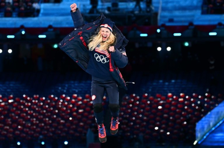 USA's Jessie Diggins celebrates her silver on the podium at the closing ceremony