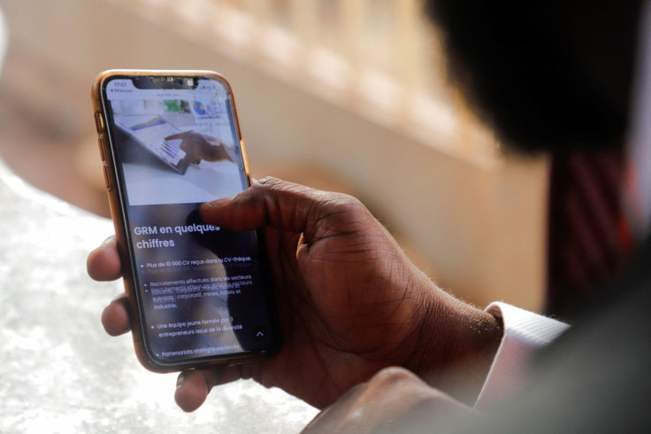 Issiaka Mahmoud Bah, managing director of Golden Resources Management, a recruitment firm, show the company's dashboard on his mobile phone in Bamako, Mali February 18, 2022.