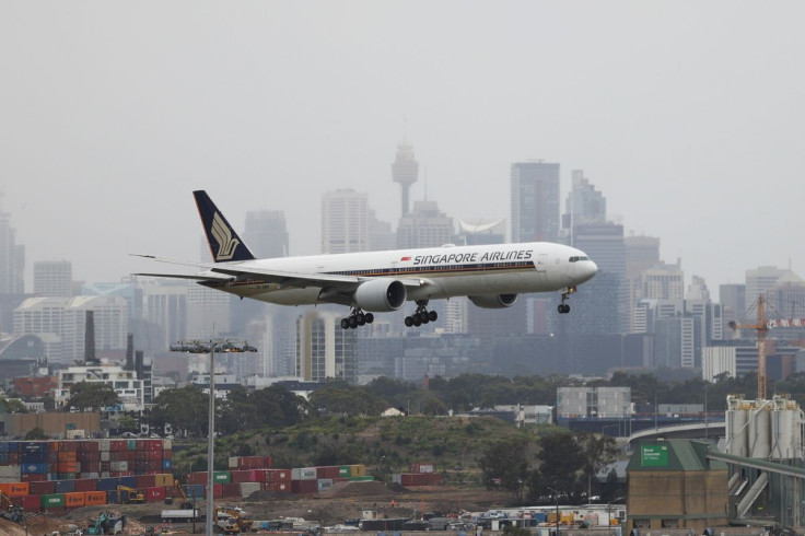 A Singapore Airlines plane arriving from Singapore lands at the international terminal at Sydney Airport, as countries react to the new coronavirus Omicron variant amid the coronavirus disease (COVID-19) pandemic, in Sydney, Australia, November 30, 2021.