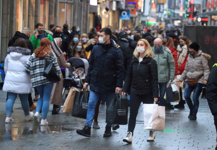 Shoppers wear mask and fill Cologne's main shopping street Hohe Strasse (High Street) in Cologne, Germany, 12, December, 2020.