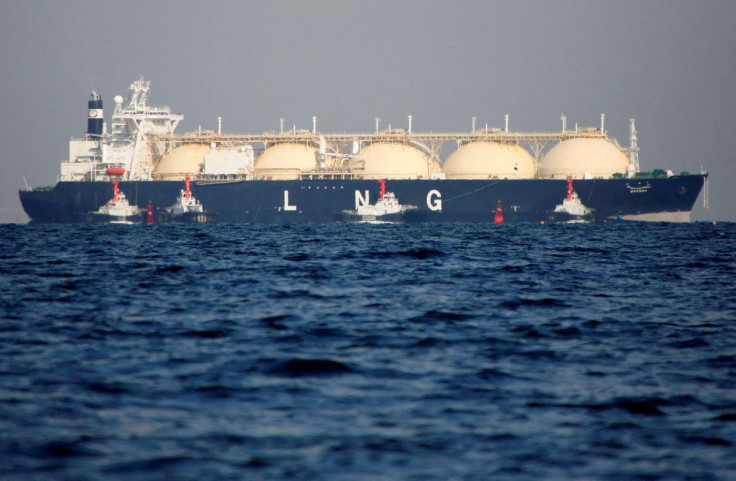 A liquefied natural gas (LNG) tanker is tugged towards a thermal power station in Futtsu, east of Tokyo, Japan November 13, 2017. 