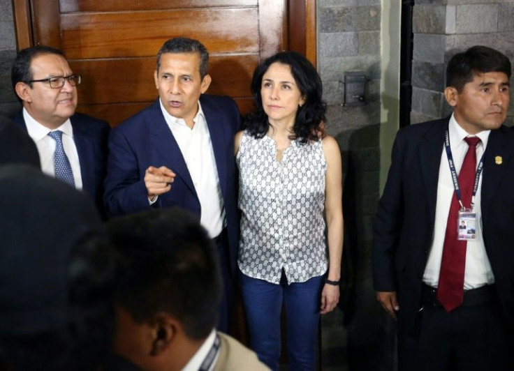 Peru's former President Ollanta Humala speaks next to his wife Nadine Heredia outside their Lima home on April 30, 2018