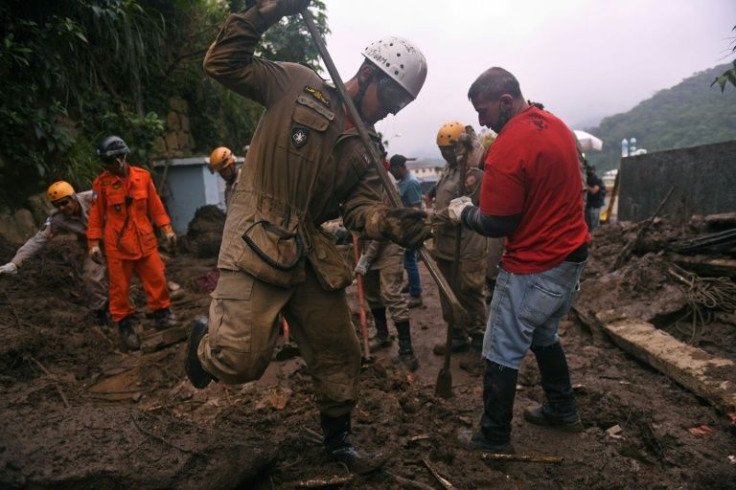 Firefighters and volunteers are seen during a rescue mission after a giant landslide at Caxambu neighborhood in Petropolis, Brazil, on February 19, 2022