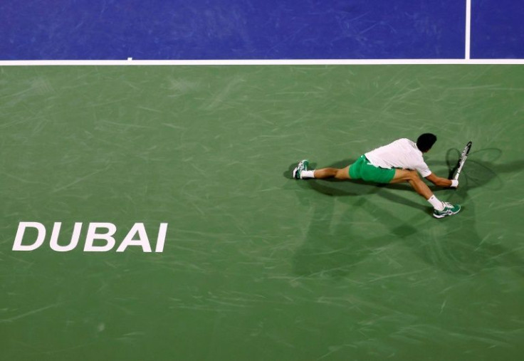 Back in business: Novak Djokovic returns the ball to Lorenzo Musetti during his win on Monday